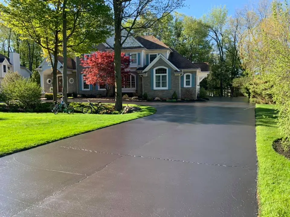 Freshly sealcoated asphalt driveway